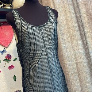 Elegant unbranded sleeveless black and silver beaded fringe mini dress. Size M.